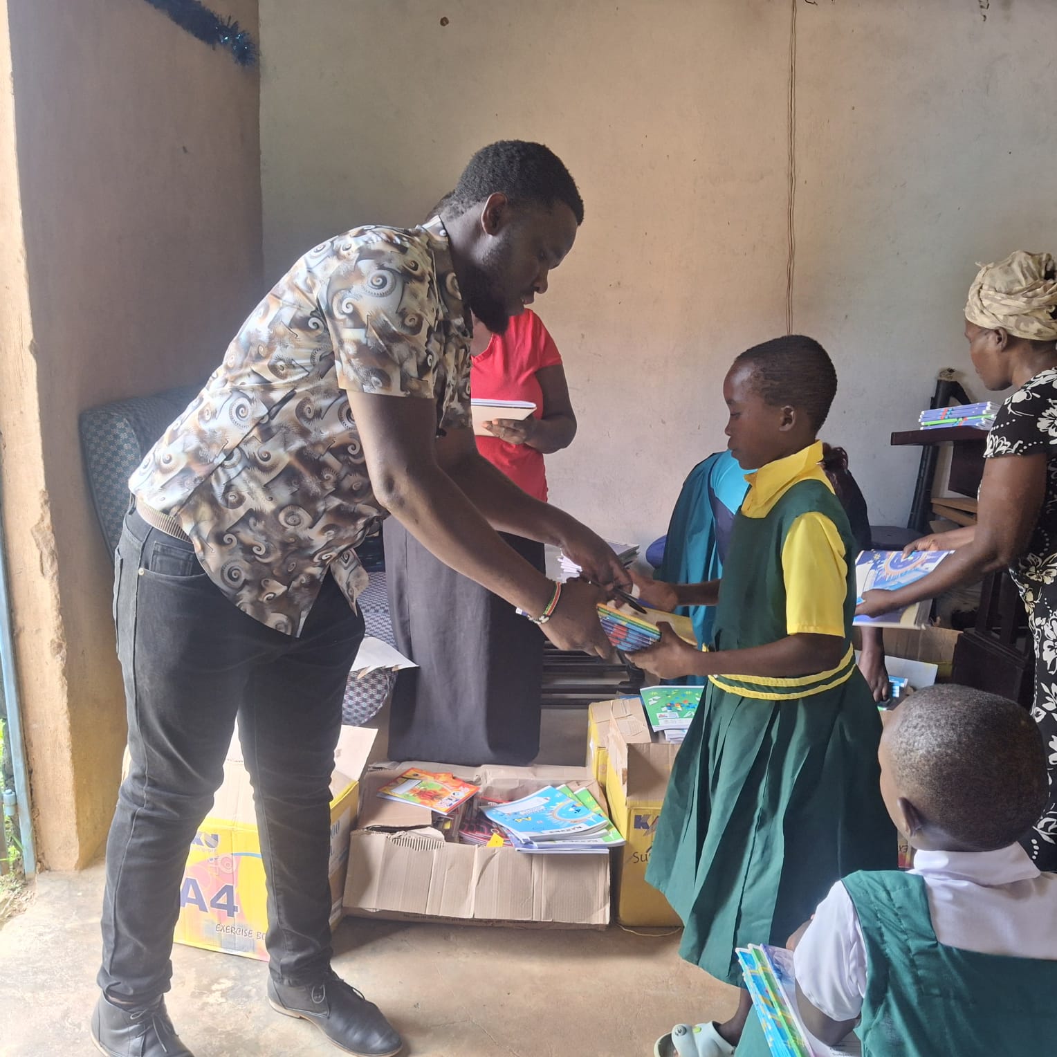 Pastor Jack Sharing Books Among Children